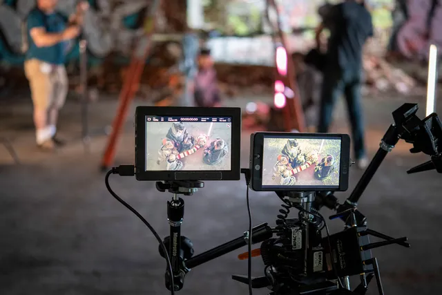 two camera monitors showing the actors