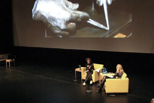 Lisa Cartwright and Christin Lammer seated on stage in conversation. 