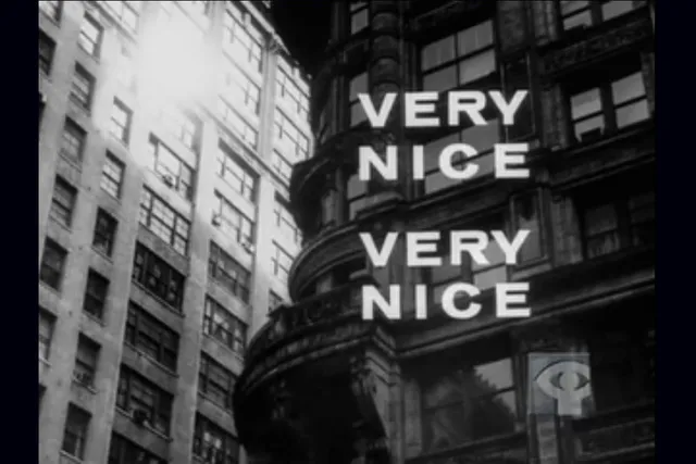 Black and white turn of the century building facade in a city with the text 'VERY NICE, VERY NICE' in bold font over top. 