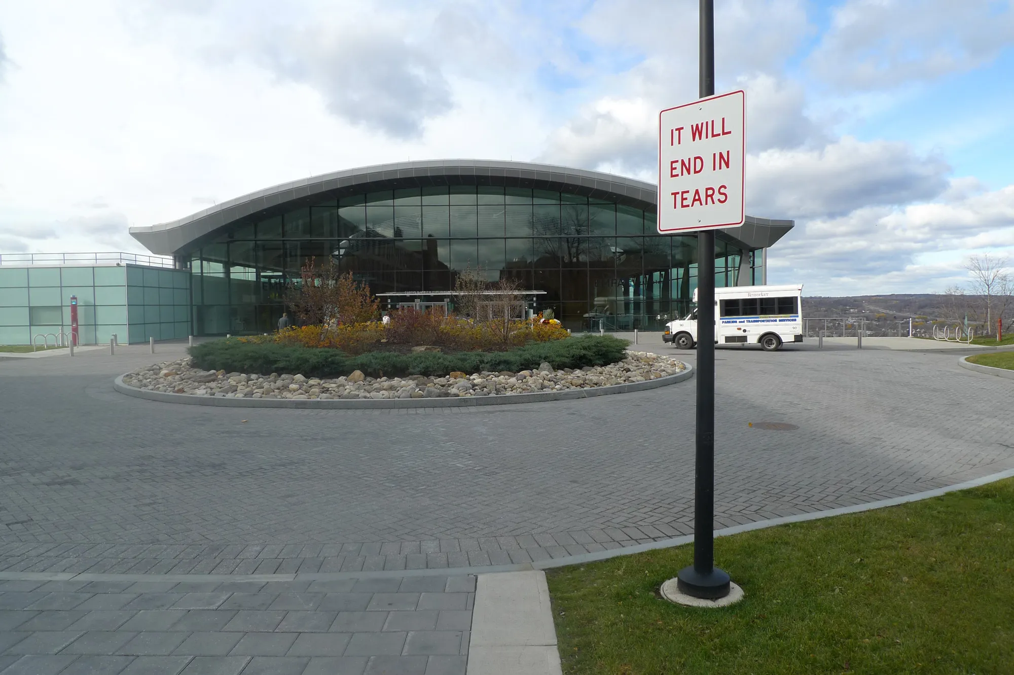 A street sign reading It Will End In Tears in front if the exterior of EMPAC