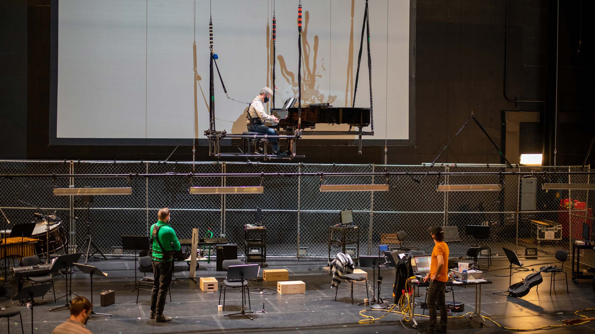 a flown piano on the theater stage