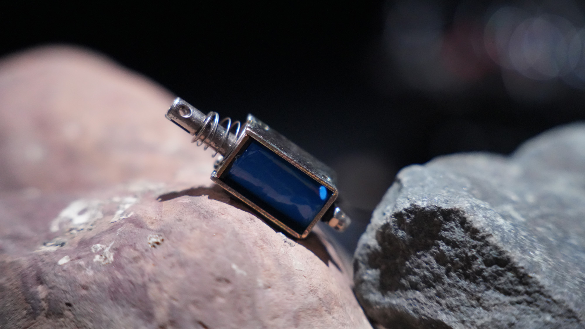 an actuator sits atop a rock