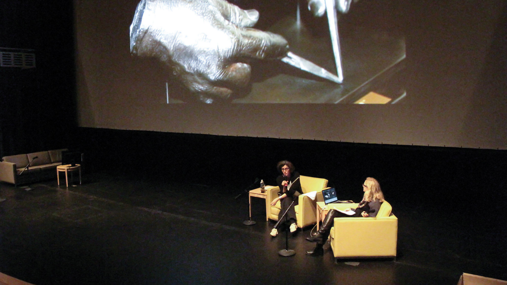Lisa Cartwright and Christin Lammer seated on stage in conversation. 