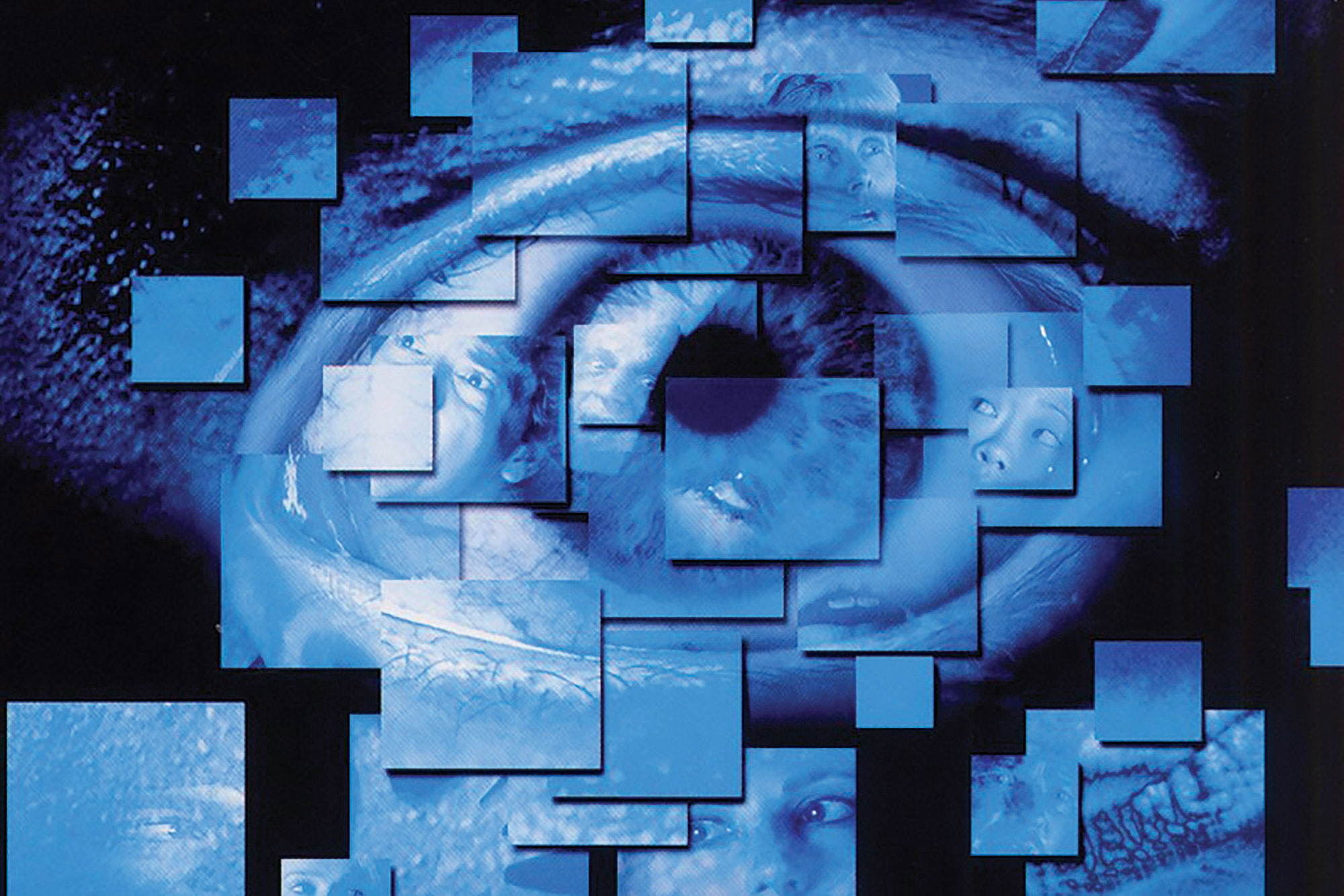 Up close image of a human eye with overplayed cubes of various sizes in blue. 