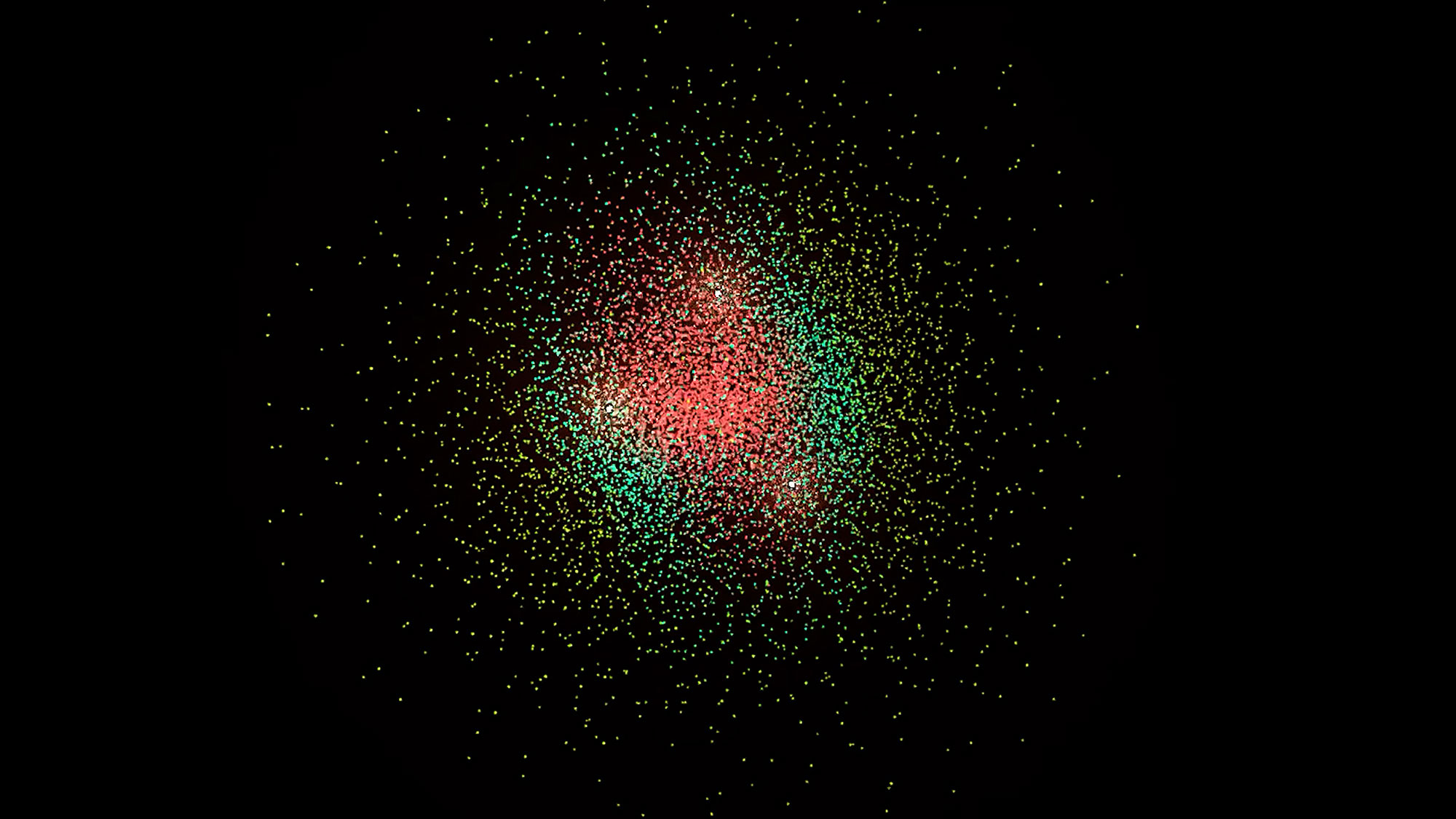 a pointilist image of a cloud of points colored in red, green, and yellow on a black background