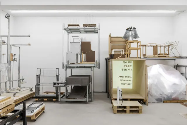 a white room with boxes and apparatus