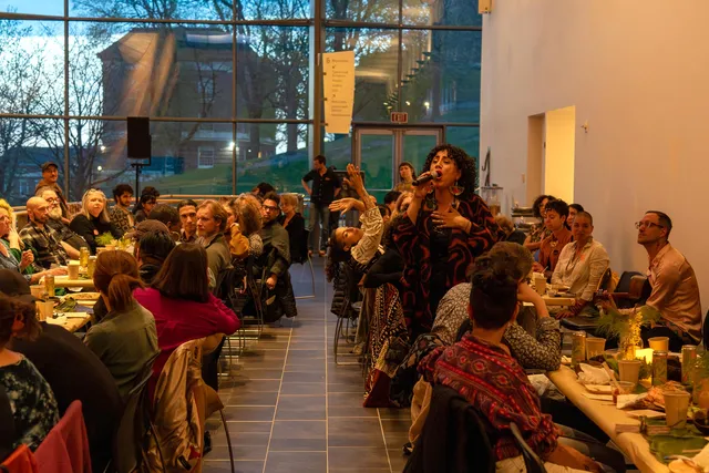 a long table meal on the mezzanine of a performing arts center