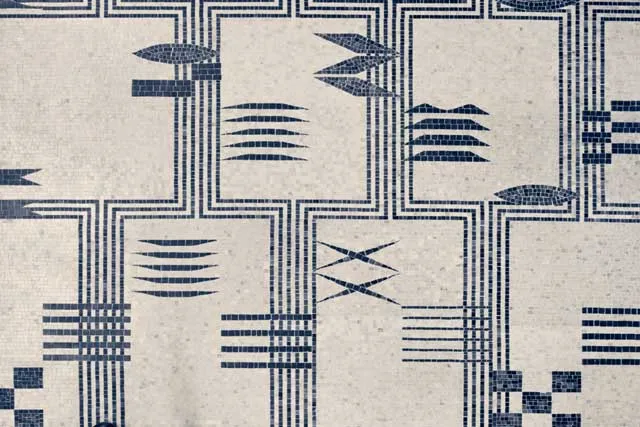 a blue on beige geometric mosaic pattern