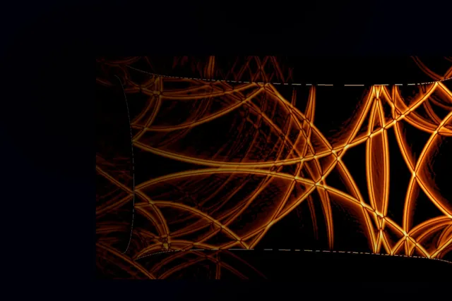 Abstract image of orange lines of light randomly placed among a black background. 