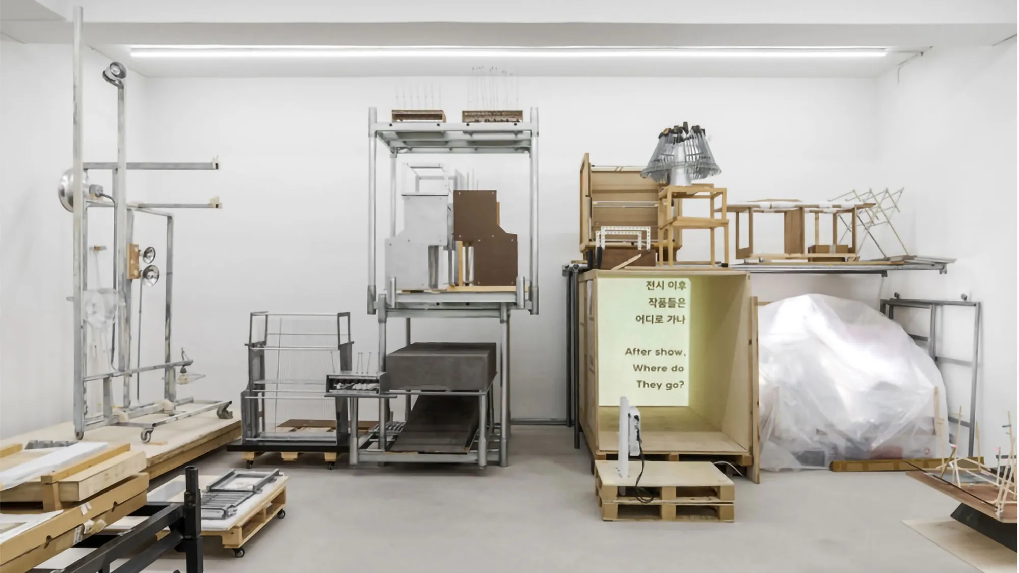 a white room with boxes and apparatus