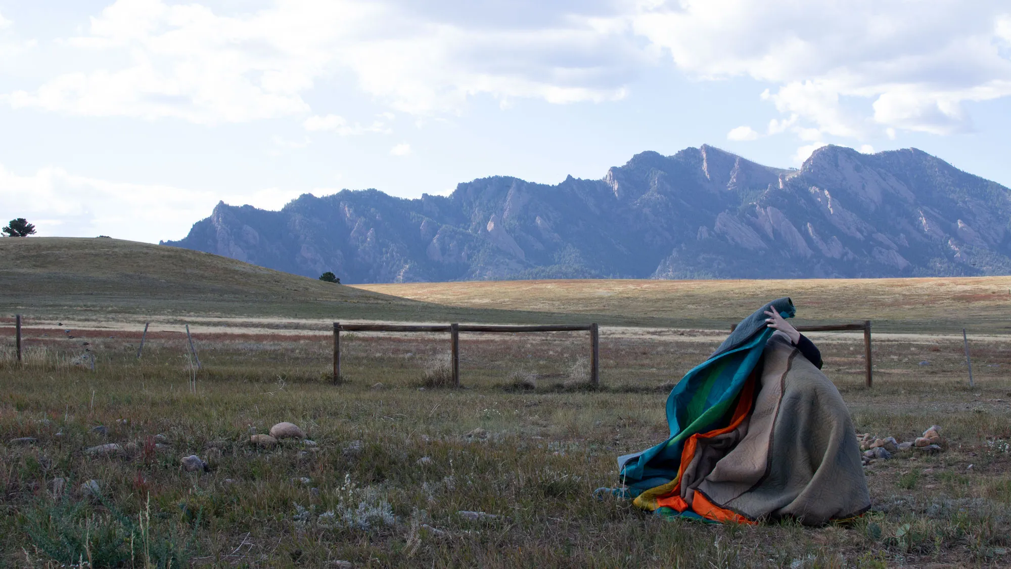 a mountainous landscape with a valley in the foreground 