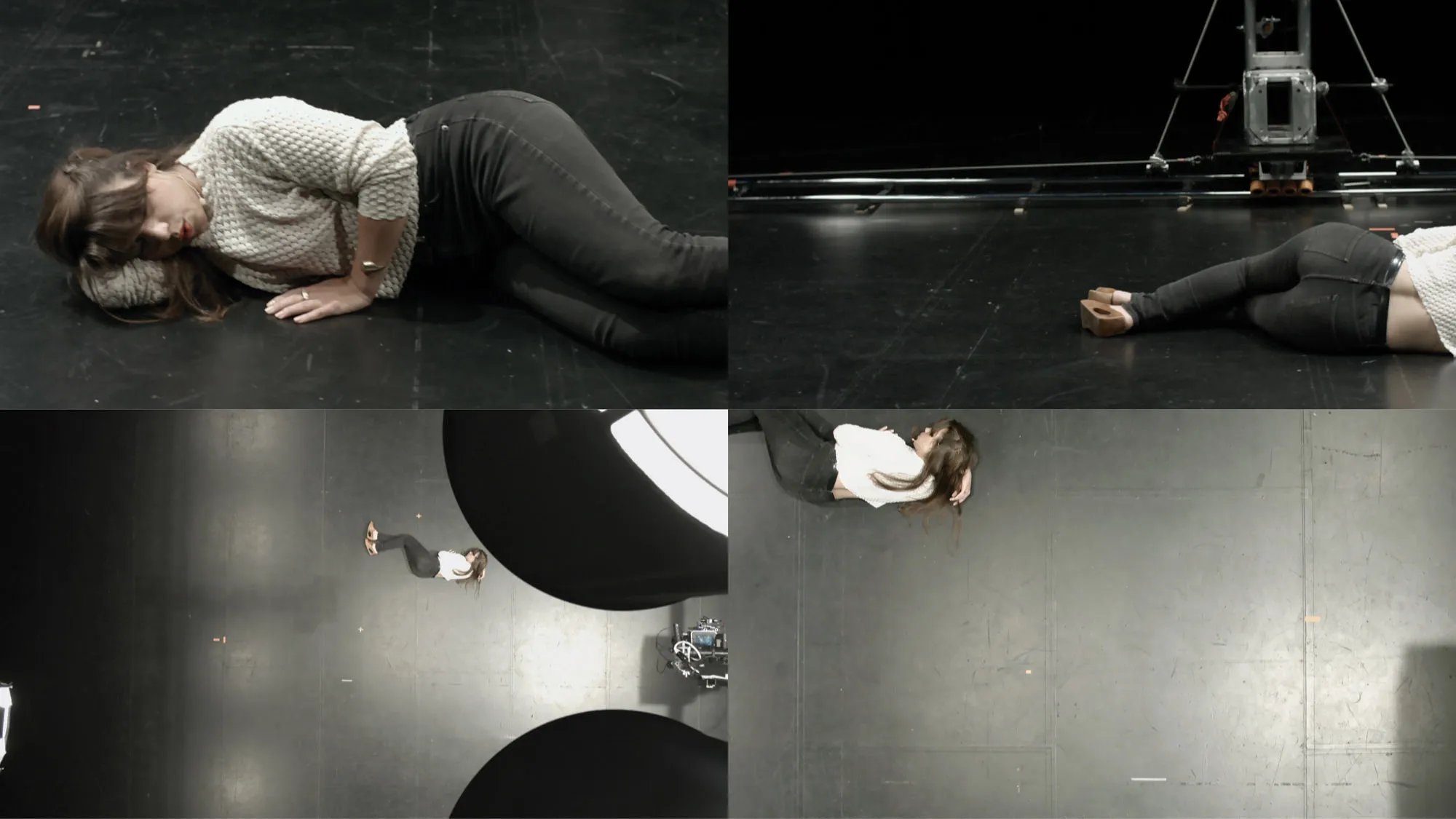 Four frames capturing Patricia Boyd laying down on a black floor from the front, back, and aerial views