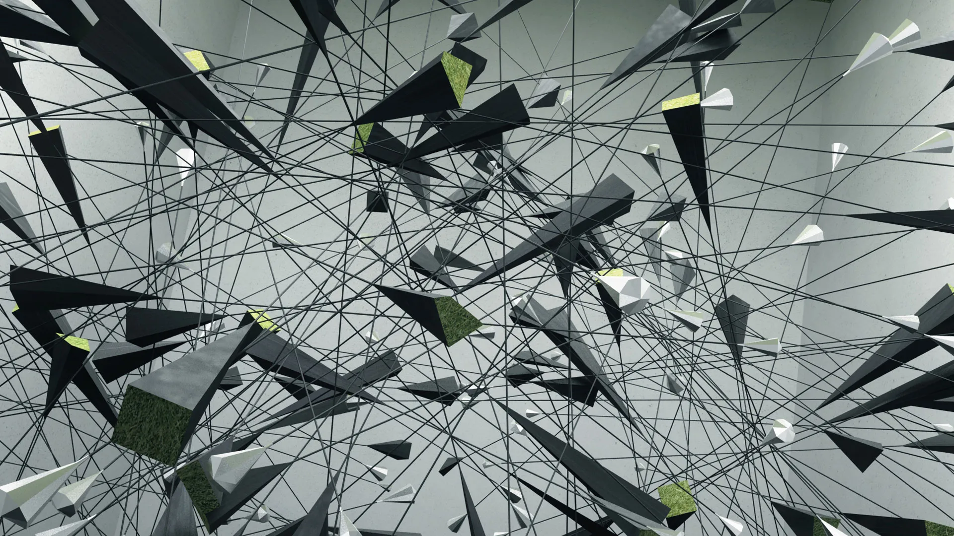 Gray and green pyramids strewn about a web or black lines in a gray room.