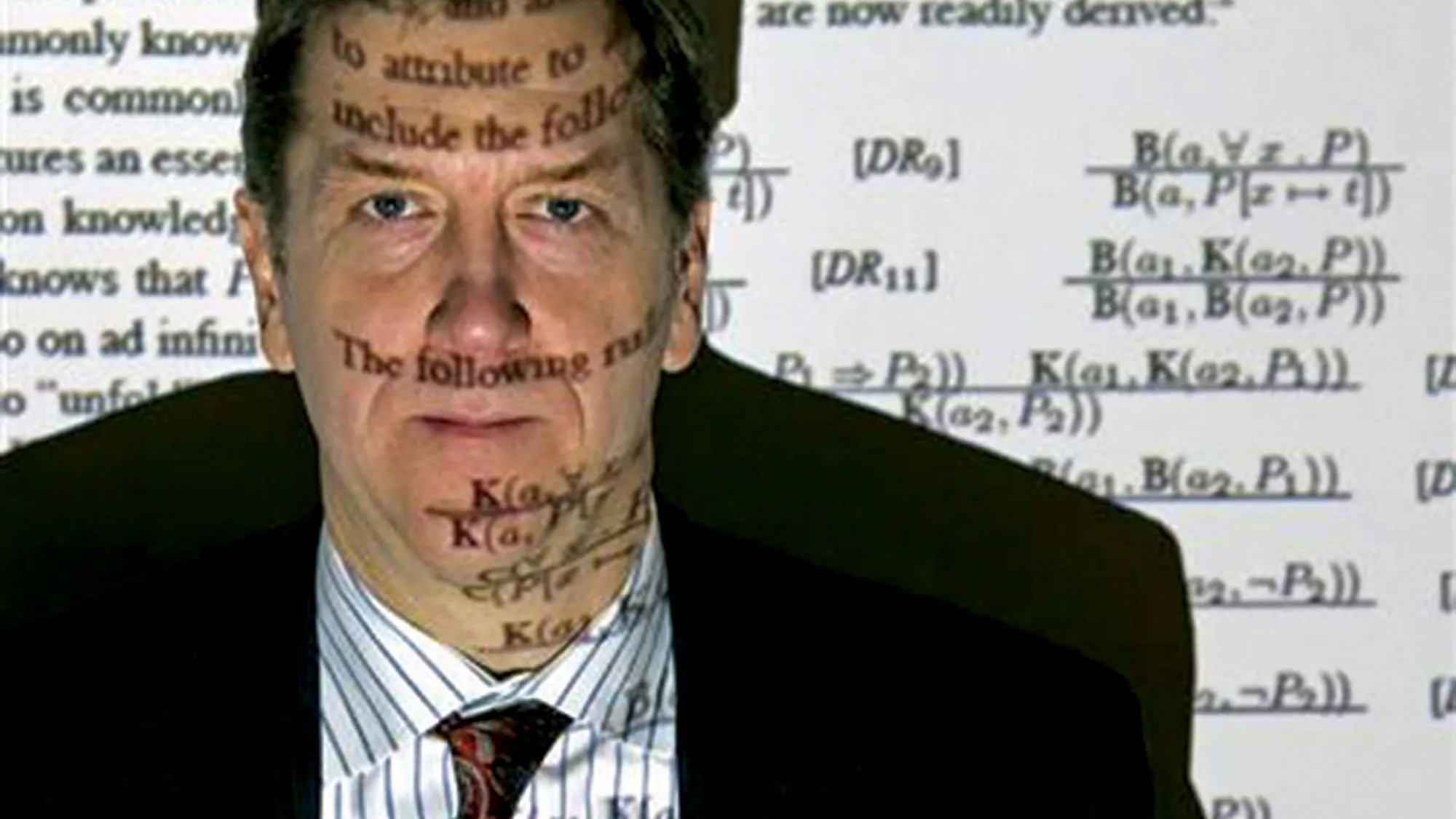 Selmer Bringsjord with equations projected over his face. 